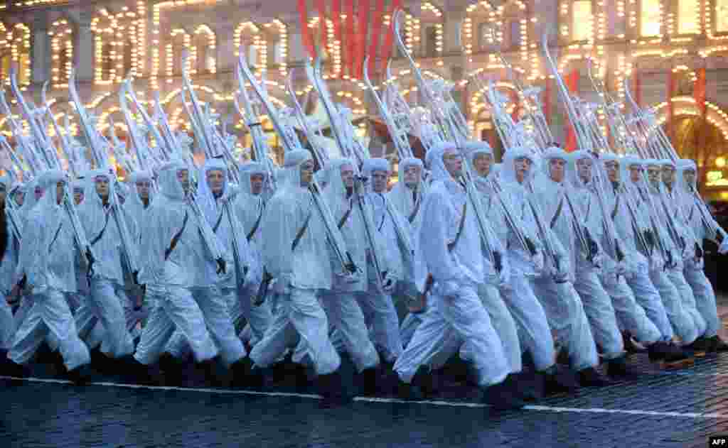 Wearing WWII-era white winter camouflage uniforms and carrying skis, Russian soldiers march at Red Square in Moscow on November 5. (AFP/Vasily Maximov)