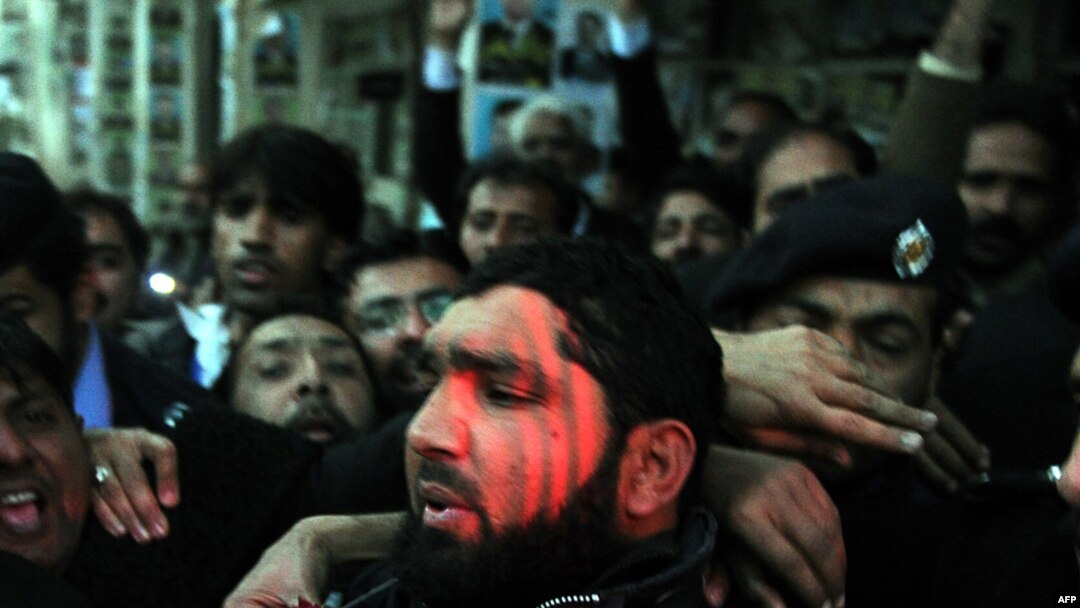 Images of killer Malik Mumtaz Hussain Qadri feted by supporters and garlanded with flowers in custody shocked critics of Pakistan's hard-line religious establishment.