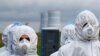 Employees of Belarus&#39;s first nuclear power plant take part in emergency services drills near the town of Ostrovets on October 11. (Reuters/Vasily Fedosenko)