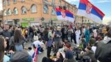 Students rest in the Batajnica neighborhood of Belgrade during the protest walk to Novi Sad.