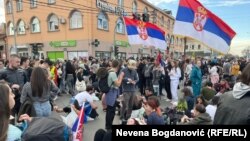 Students rest in the Batajnica neighborhood of Belgrade during the protest walk to Novi Sad.