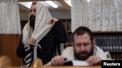 Jewish men attend morning prayers at a synagogue in Donetsk, in eastern Ukraine.