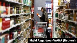 An Iranian woman shops in a store in Tehran on April 28.