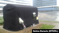 A memorial to months-old Belmina Ibrisevic, who died in a German clinic after delays in getting a passport.