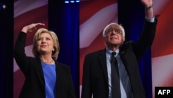 Hillary Clinton (left) and Bernie Sanders appear at the Democratic Party debate on January 17.