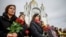 People gather to mark the fourth anniversary of the full-scale Russian invasion, in Bucha