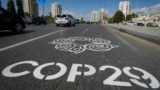 A mural painted on a highway welcomes visitors ahead of the 29th UN Climate Change Conference in Baku, scheduled for November 11-22.