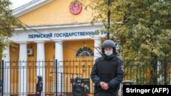 Russian police officers on patrol at Perm State University, where a deadly shooting rampage took place on September 20. 