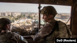 U.S. Army soldiers keep watch on the U.S. Embassy compound in Baghdad on January 1.