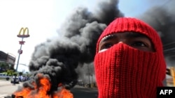 Supporters of President Manuel Zelaya protest against the coup in Tegucigalpa 