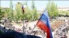 Российский флаг над зданием горсовета Мариуполя