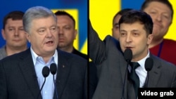 Petro Poroşenko ve Volodımır Zelenskıy, 2019 senesi aprelniñ 19-ı, «Olimpiyskıy» stadionı, Kyiv