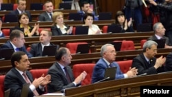 Armenia - Deputies from the ruling Republican Party applaud after the National Assembly adopts a statement on the 100th anniversary of the Armenian genocide, Yerevan, 21Apr2015.