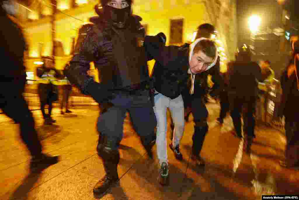 Police detain a man in St. Petersburg.