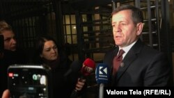 Former Kosovo Liberation Army commander Rrustem Mustafa speaks with reporters as he leaves The Hague-based Kosovo Specialist Chambers and Specialist Prosecutor's Office after questioning on January 15.