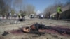 \A sandal is seen laying on the ground along a road at the site of a suicide bombing attack in Kabul on March 21.