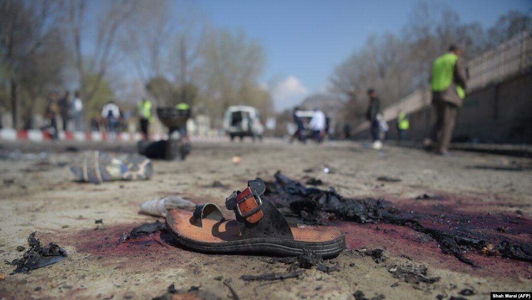 A sandal is seen lying on the ground along a road at the site of a suicide bombing in Kabul on March 21.