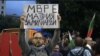 Screengrab from protester holding a poster during the proest in SOfia Bulgaria 