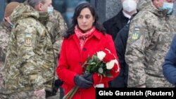 Canadian Defense Minister Anita Anand attends a ceremony to lay flowers at a memorial to fallen defenders of Ukraine in Kyiv on January 31.