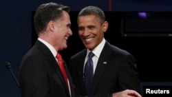 U.S. President Barack Obama (right) and Republican presidential nominee Mitt Romney share a laugh at the end of the first presidential debate.