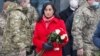 Canadian Defense Minister Anita Anand attends a ceremony to lay flowers at a memorial to fallen defenders of Ukraine in Kyiv on January 31.
