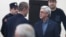 Ex-President Serzh Sarkisian (right) appears in court in Yerevan on February 25.