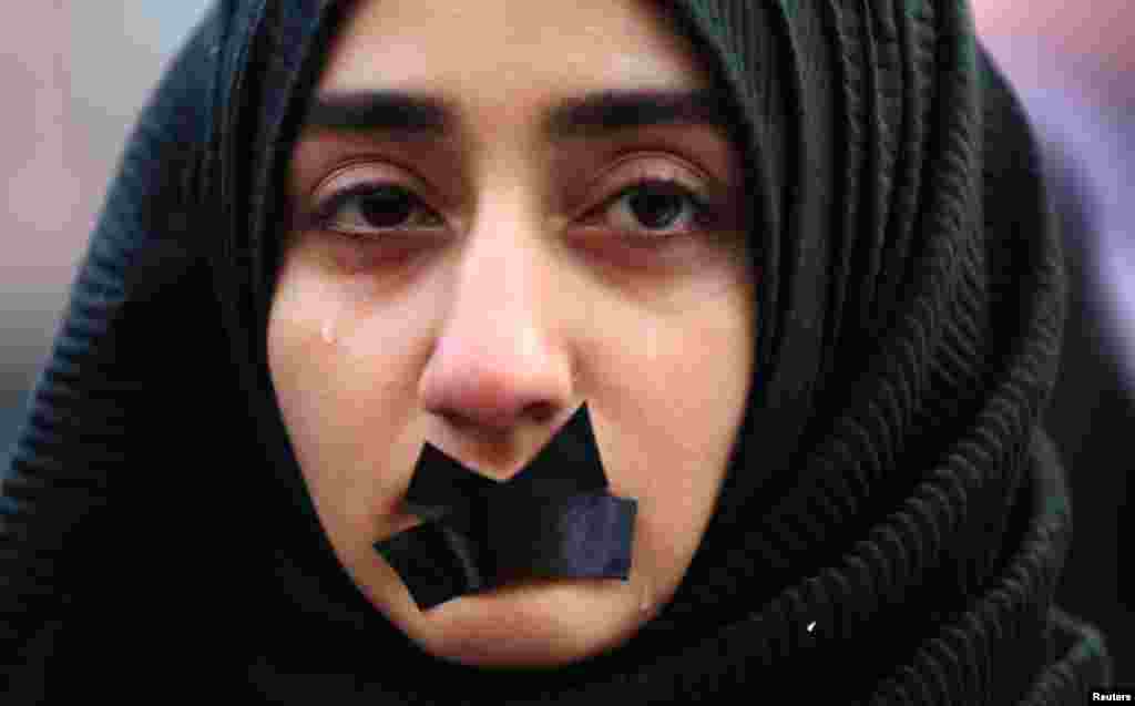 A Turkish student cries during a protest to show solidarity with trapped citizens of Aleppo, Syria, in Sarajevo on December 14. (Reuters/Dado Ruvic)