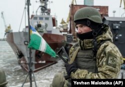 A Ukrainian serviceman stands on board a Coast Guard ship in the Sea of Azov. (file photo)