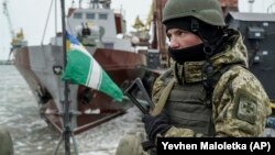 A Ukrainian serviceman stands on board a Coast Guard ship in the Sea of Azov. (file photo)