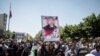 People attend the funeral of the victims of June 7 attack at the Iranian parliament and Ayatollah Khomeini's mausoleum, June 9, 2017