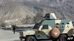 A police armored vehicle is parked outside the jail in Gilgit on February 27.