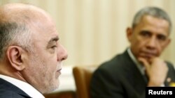 Iraqi Prime Minister Haidar Al-Abadi (left) and U.S. President Barack Obama deliver remarks to reporters after their bilateral meeting in the Oval Office at the White House in Washington on April 14.