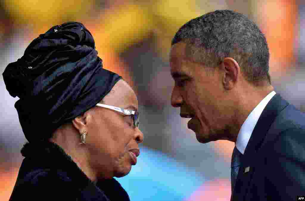 Obama pays his respects to Graca Machel, Mandela's third wife.