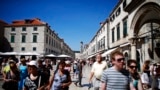 Tourists walk in Croatia's UNESCO protected medieval town of Dubrovnik August 28, 2012. From July, tourists and truckers will have to cross the external borders of the EU to go from one part of Croatia to another, negotiating long, costly queues and stric