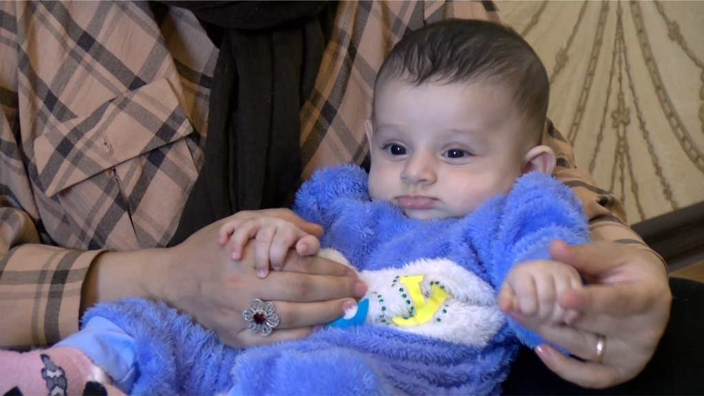 'For The Sake Of The Future': Afghan Couple Fled Taliban Threats To Have Child In Tajikistan