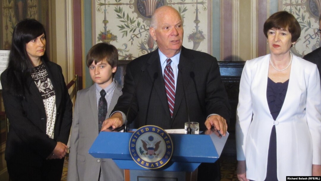 U.S. Senator Benjamin Cardin speaks alongside members of Sergei Magnitsky's family (left to right: Magnitsky's widow, Natalia; his son, Nikita; Senator Cardin; and Magnitsky's mother, Natalia)