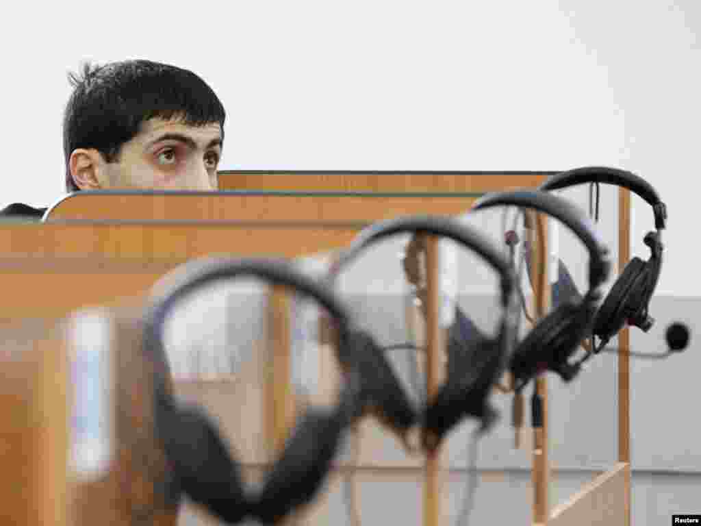 An immigrant to Russia ponders a Russian-language test set by the Russian migration service in the southern city of Stavropol. Photo by Eduard Korniyenko for Reuters