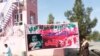 A banner in Lashkar Gah, Helmand calls on the Taliban to announce a ceasefire.