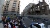 Armenia - Activists demonstrate outside a 19th century building (R) slated for demolition, Yerevan, 10Jun2014.