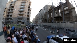 Armenia - Activists demonstrate outside a 19th century building (R) slated for demolition, Yerevan, 10Jun2014.