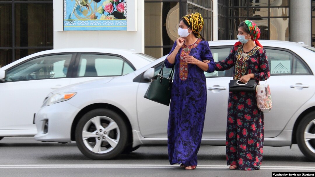 Women wear face masks as a preventive measure against the spread of COVID-19 in Ashgabat despite claims by the Turkmen government that the virus does not exist there. 