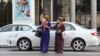 Women wearing face masks cross a street in the Turkmen capital, Ashgabat.