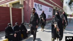 Pakistani police commandos patrol Bacha Khan university after an attack in February 2016