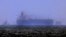 Tug boats are moored next to the Mercer Street off the United Arab Emirates' coast on August 3.