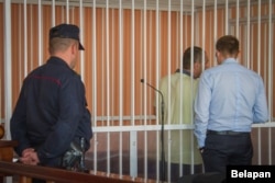 Arkadz Patapau, the deputy chief doctor at a Minsk children's hospital, is seen in the defendant's cage earlier this month. He received a six-year prison term.