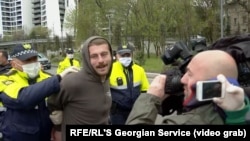 Georgian police detain coronavirus-lockdown protesters in Tbilisi on April 23.