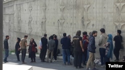 Family members of detained labor activists outside Tehran's notorious Evin prison where most protesters and dissidents are kept. Undated. 