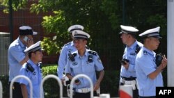 CHINA - Chinese police stand outside the US embassy in Beijing on July 26, 2018 following a blast near the embassy premises.