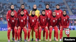 Iran players pose prior to a match between Iran in Australia on March 8.