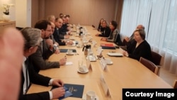 Kosovar negotiators meet with the EU's Federica Mogherini in Brussels on January 8.